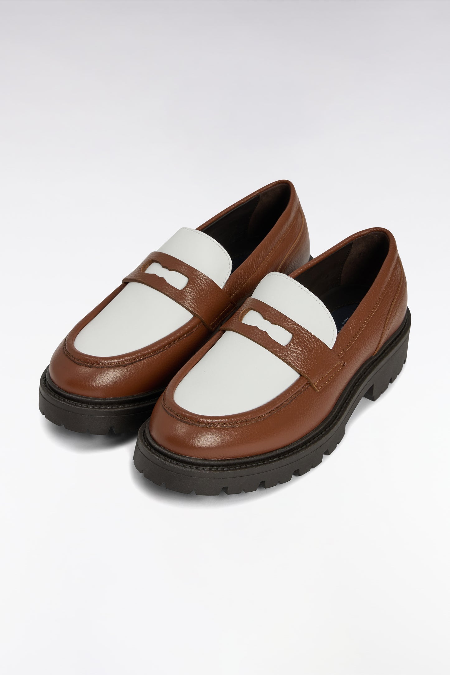 Two-tone brown and white leather loafers
