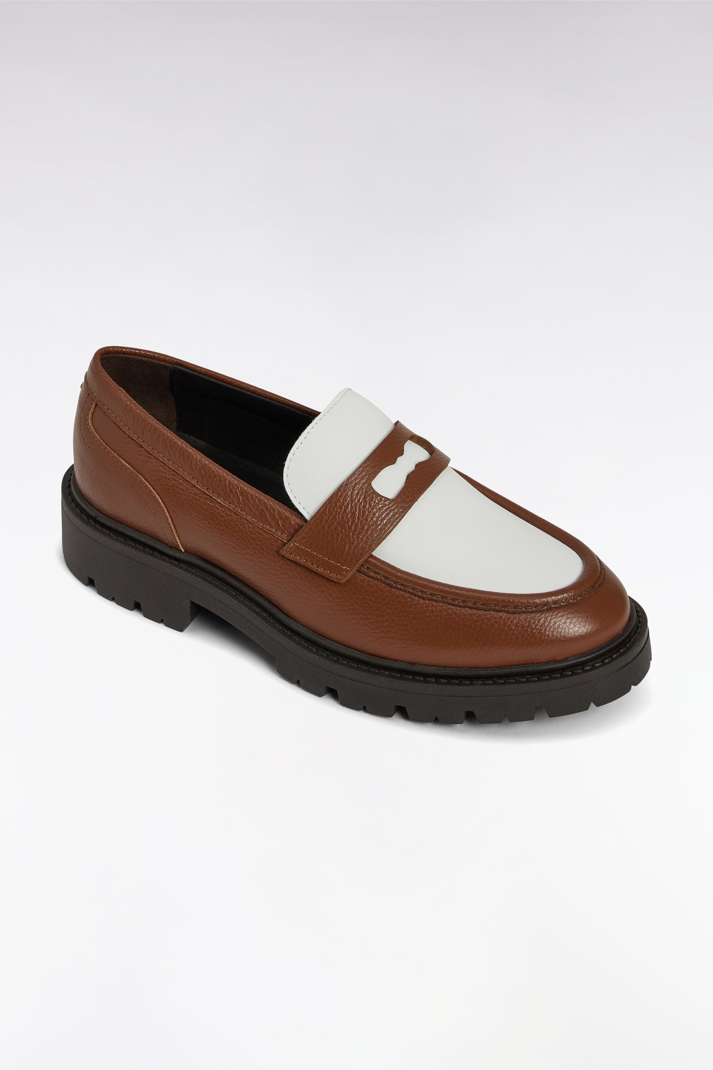 Two-tone brown and white leather loafers