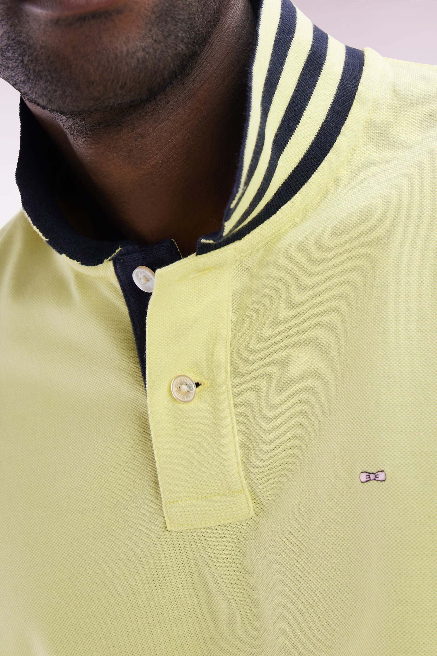 Straight-cut short-sleeved polo shirt in yellow Pima cotton piqué with striped under collar
