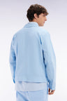 Zipped sky blue jacket in stretch cotton gabardine
