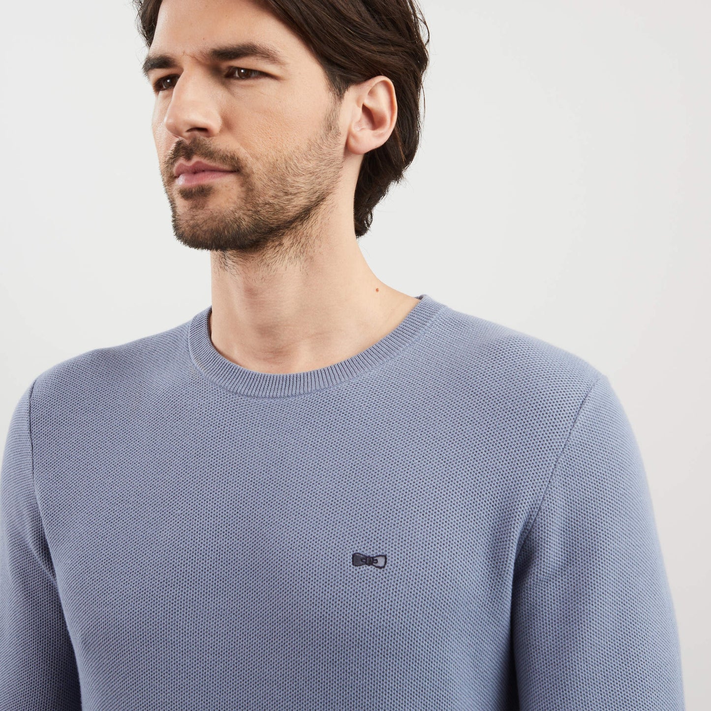 Grey jumper in decorative cable knit