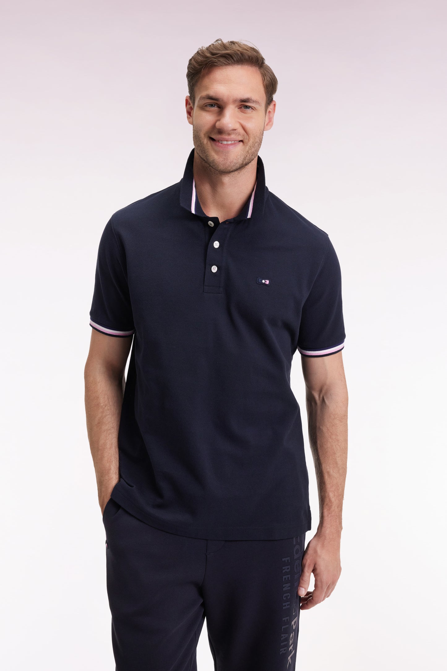 Polo manches courtes en coton marine détails rayés coupe ample