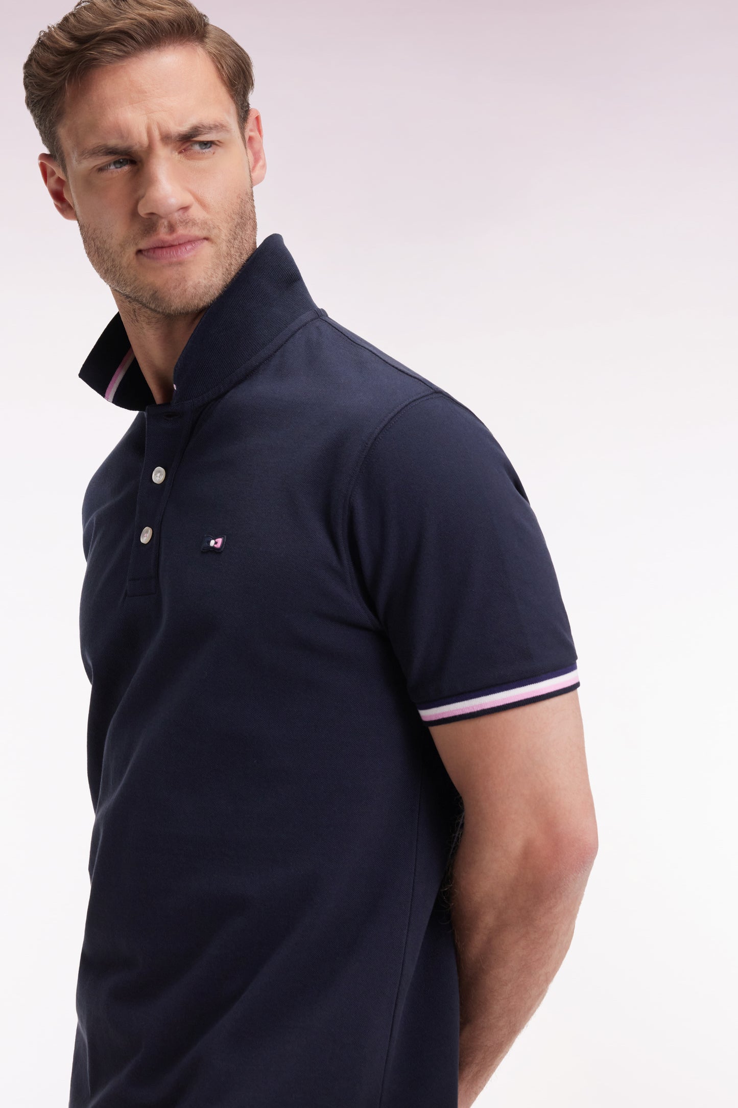 Short-sleeved polo shirt in navy cotton with striped details, loose fit