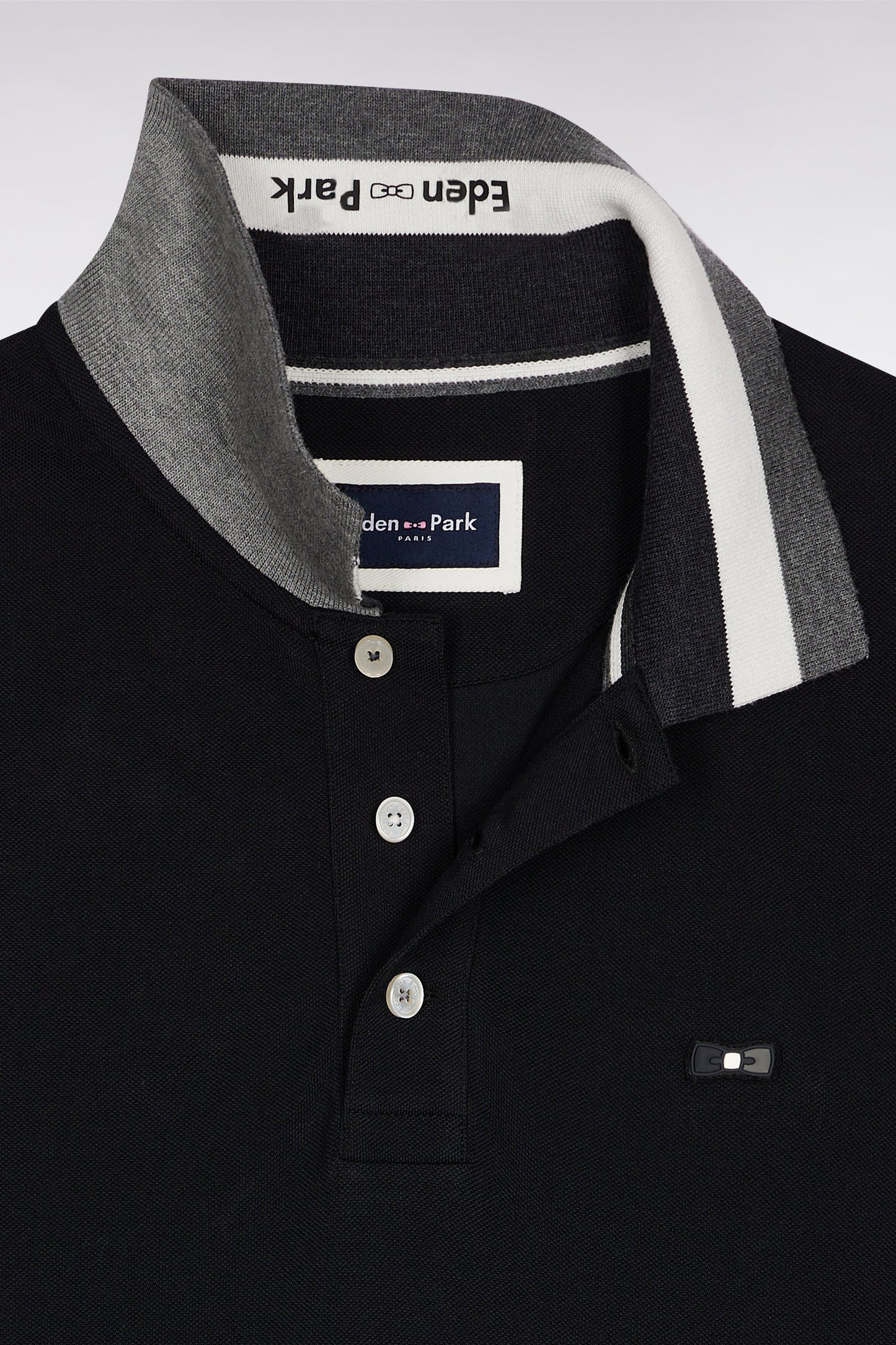 Polo manches courtes en coton noir détails tricolores coupe ample