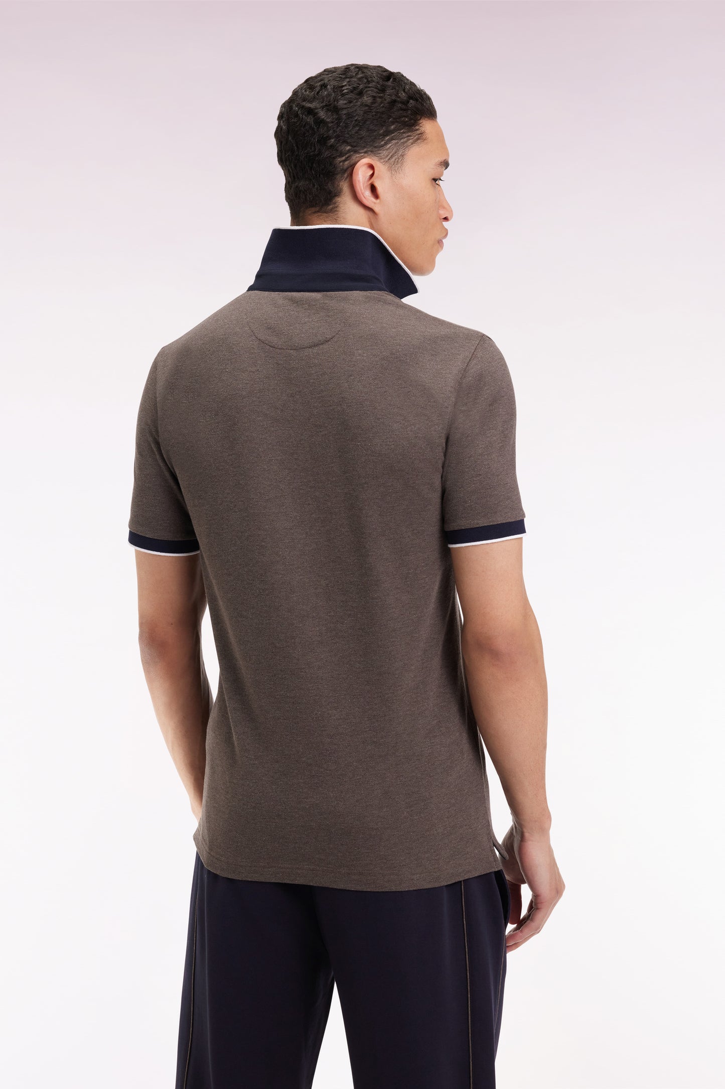 Short-sleeved polo shirt in brown stretch cotton piqué, slim fit