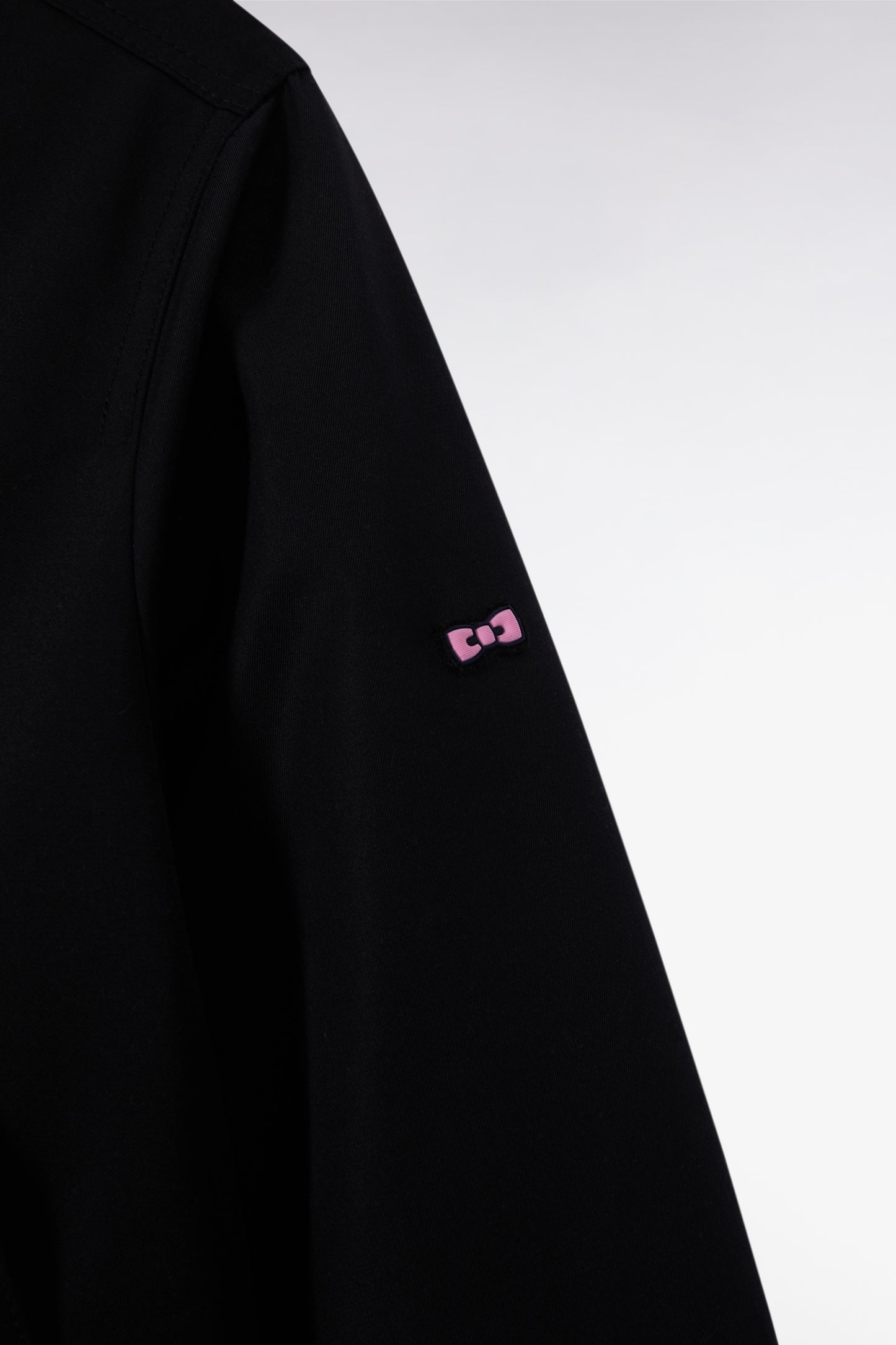 Short parka in black nylon with patch pockets