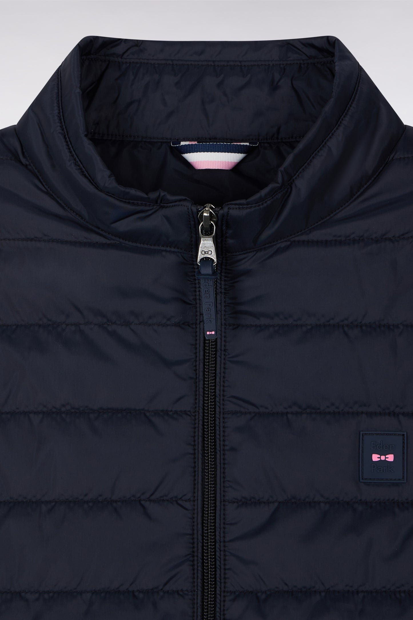 Navy blue sleeveless puffa jacket