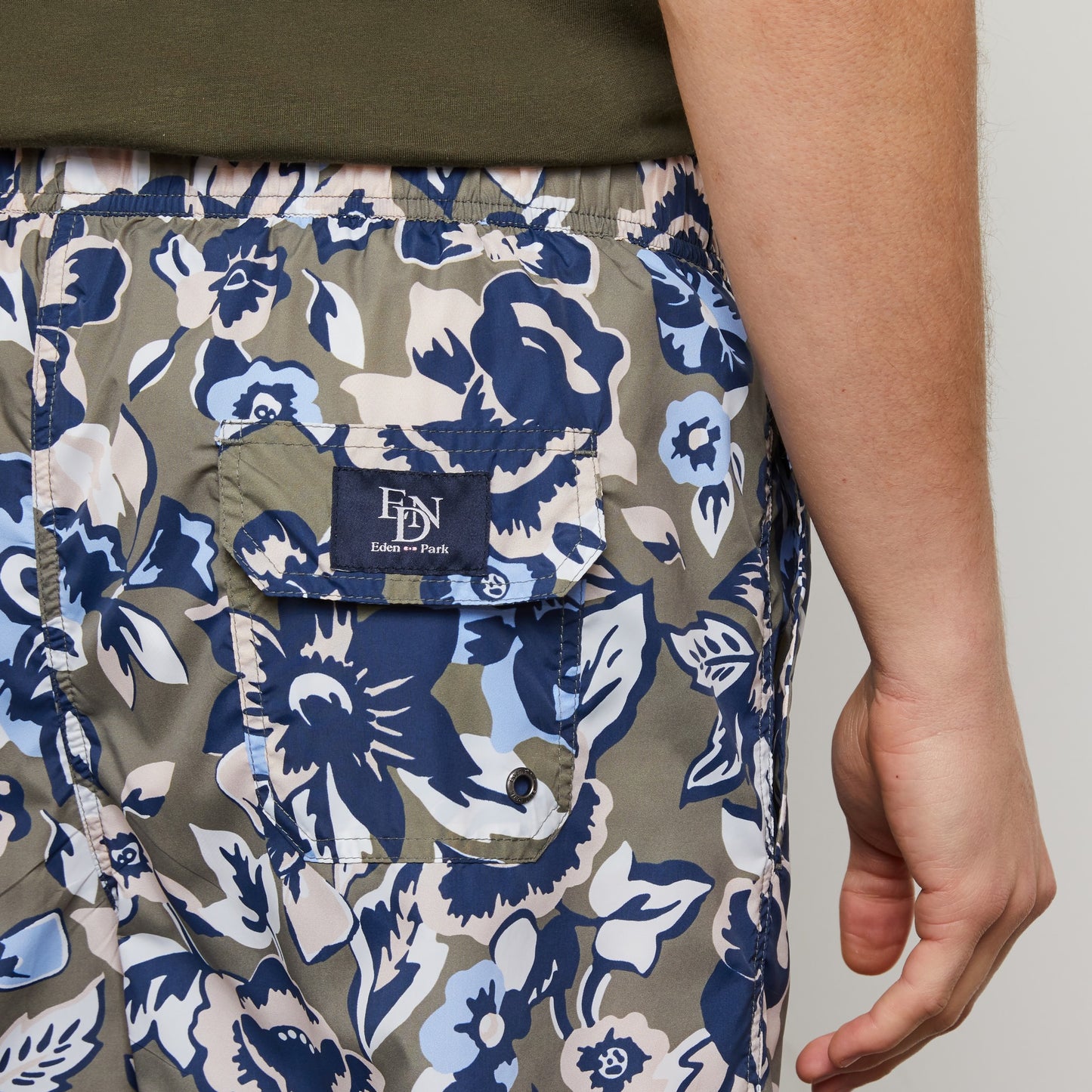 White swim shorts with exclusive floral print
