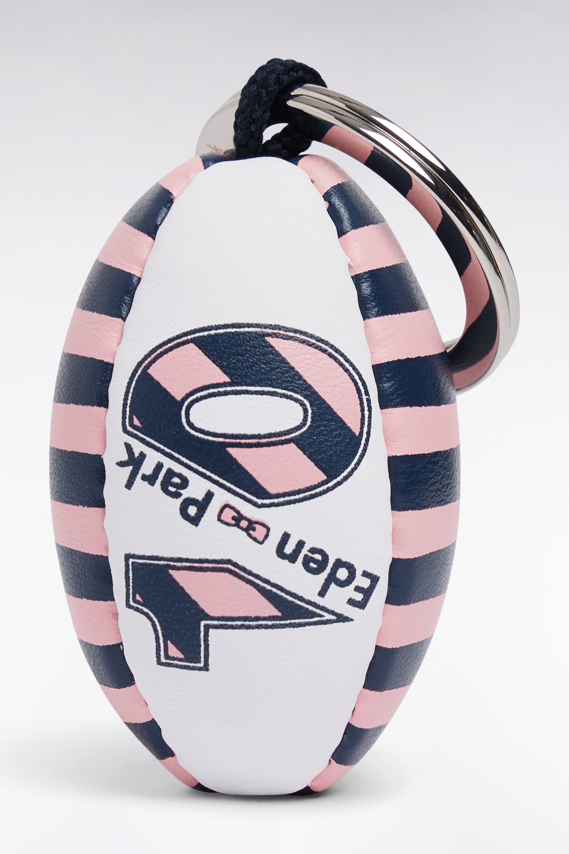 Porte-clefs ballon de rugby cerclé blanc et rose