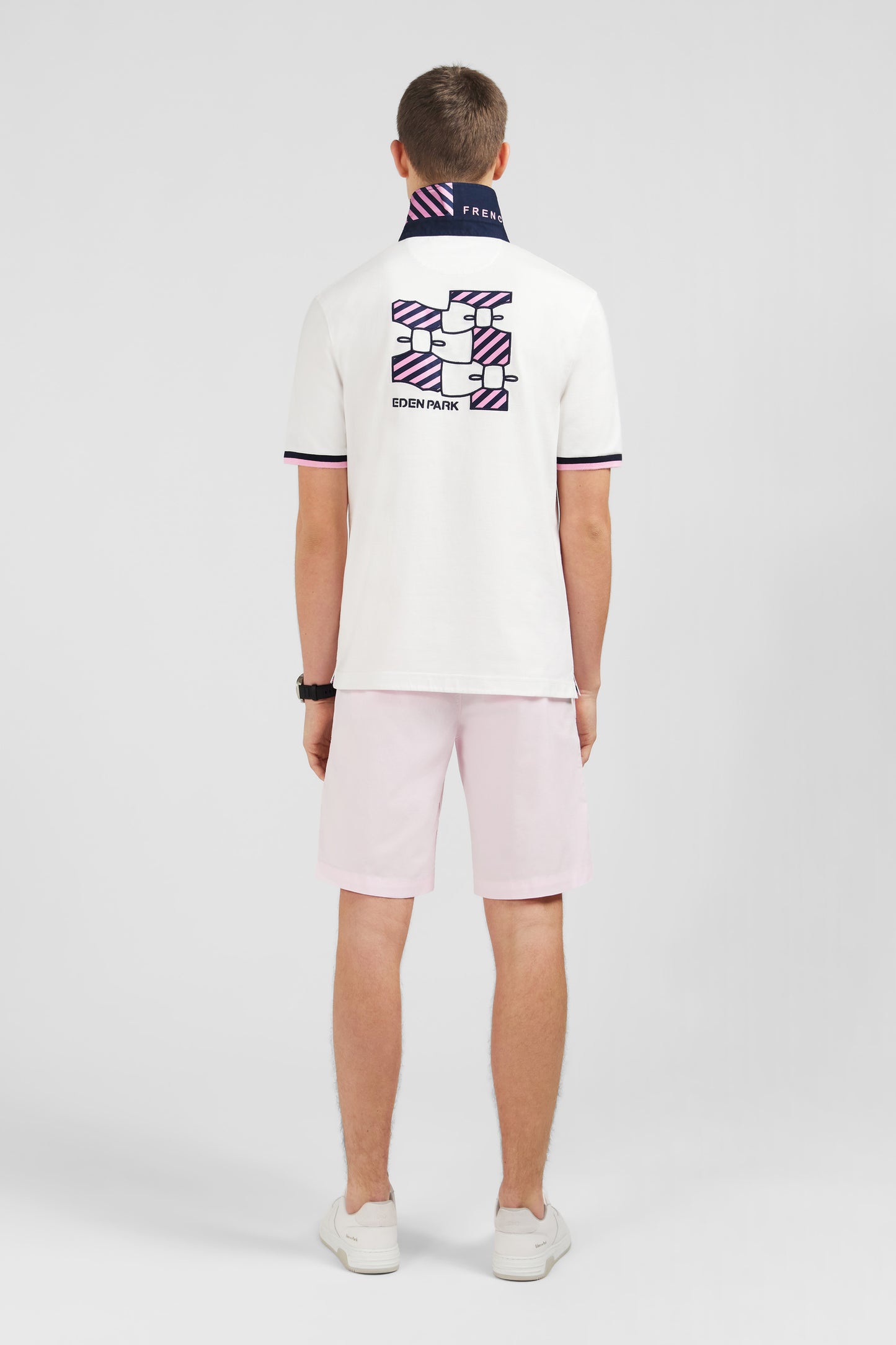 White rugby shirt with bow tie embroidery on back