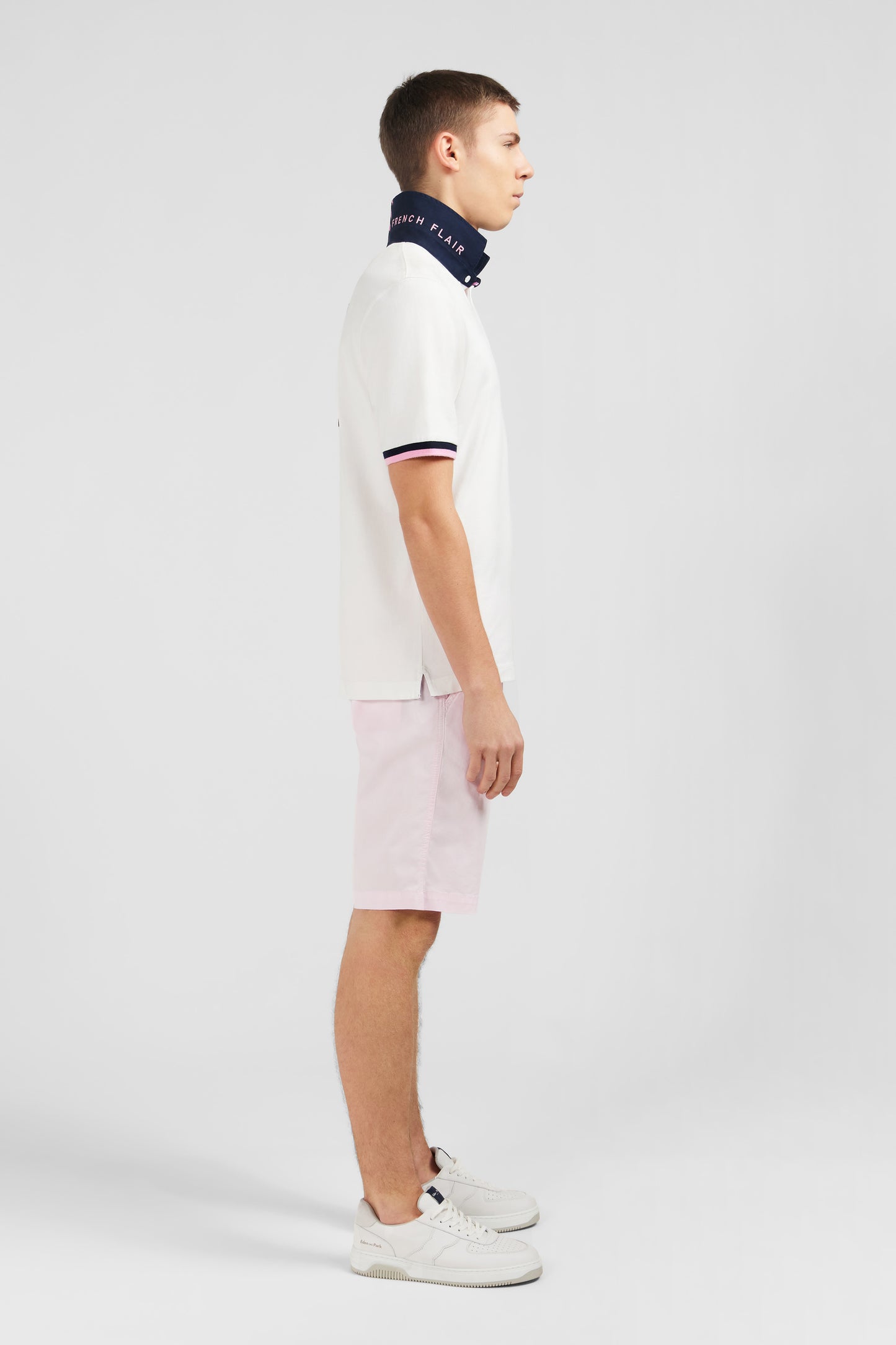 White rugby shirt with bow tie embroidery on back