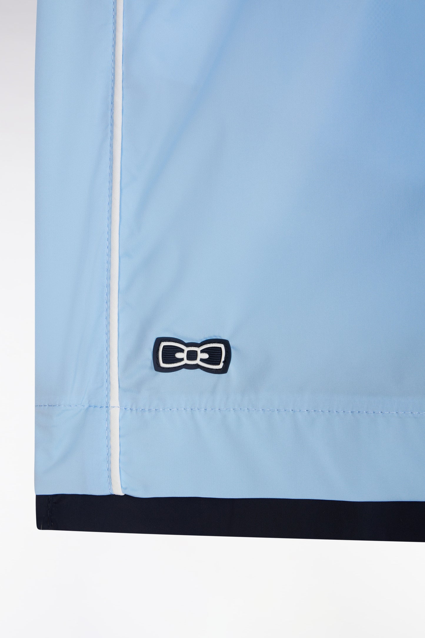 Sky blue swimsuit with white piping