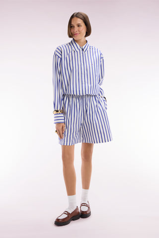 White oversized cotton shorts with blue stripes