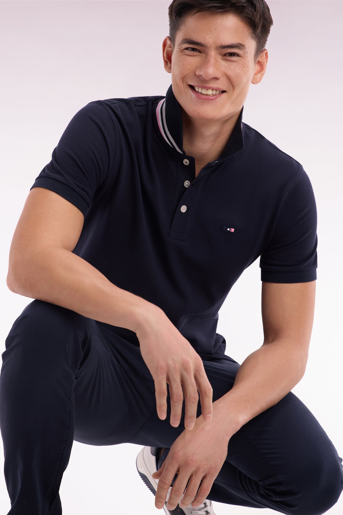 Straight-fit short-sleeved polo shirt in navy cotton piqué with tricolor embroidery
