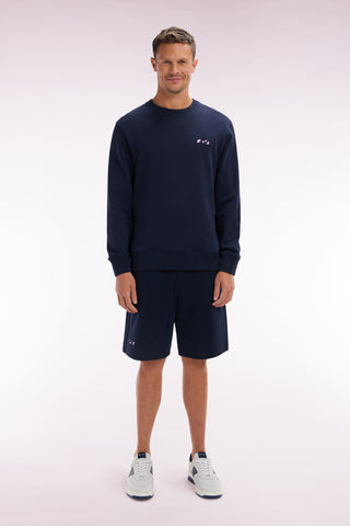 Relaxed-fit navy cotton fleece shorts with a striped bow tie embroidery