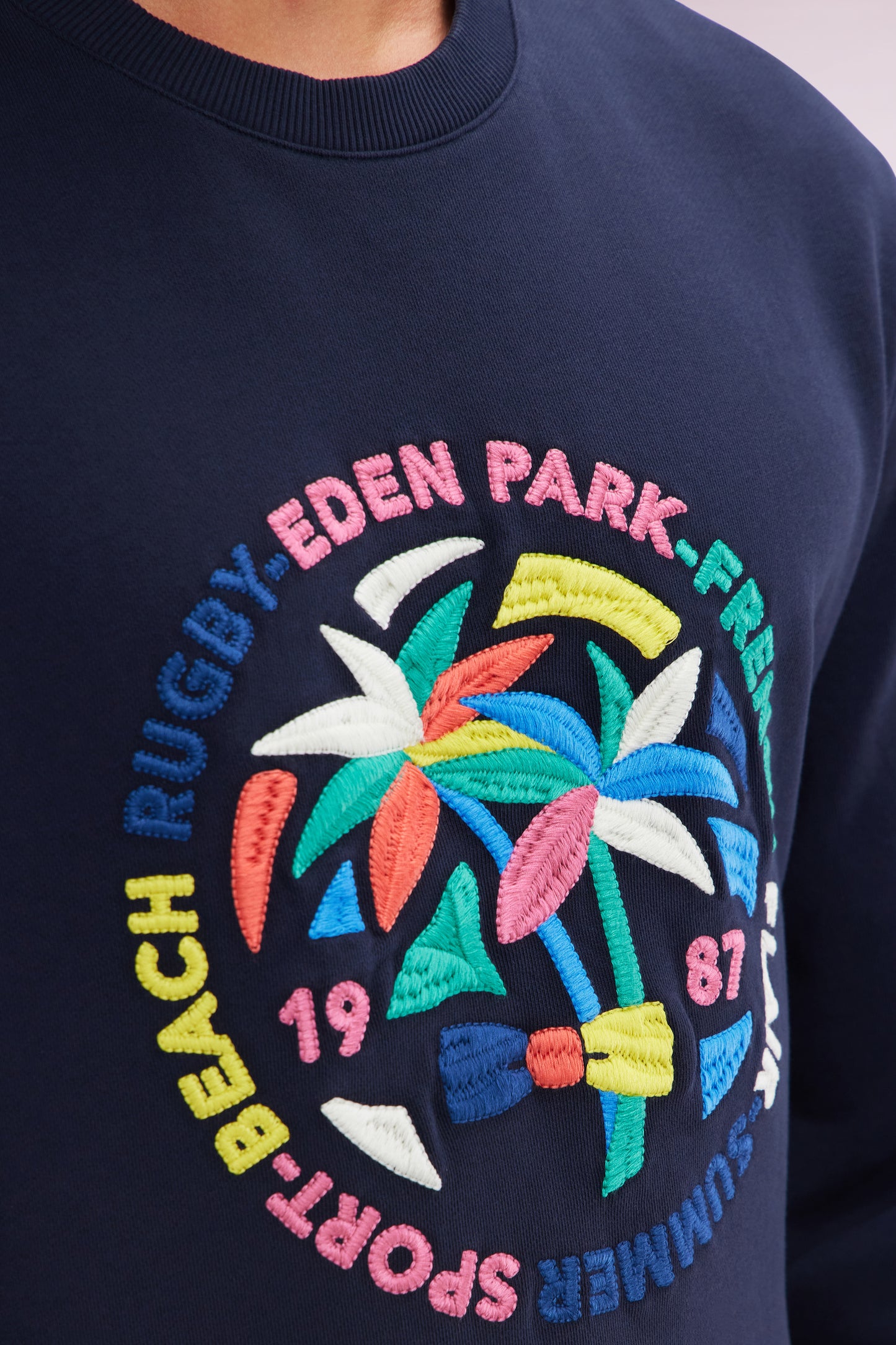 Relaxed fit navy cotton sweatshirt with multicolored palm tree embroidery
