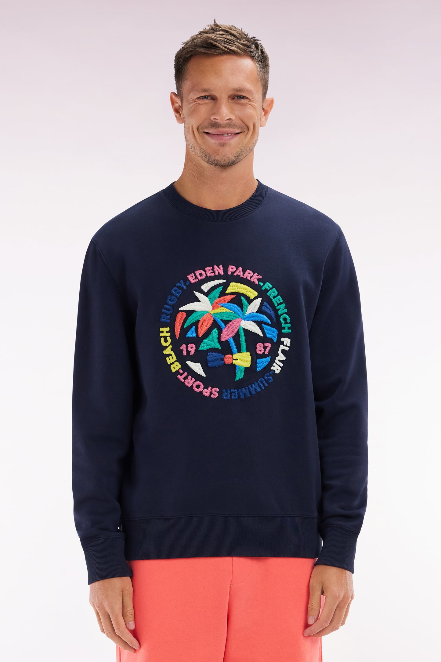 Relaxed fit navy cotton sweatshirt with multicolored palm tree embroidery