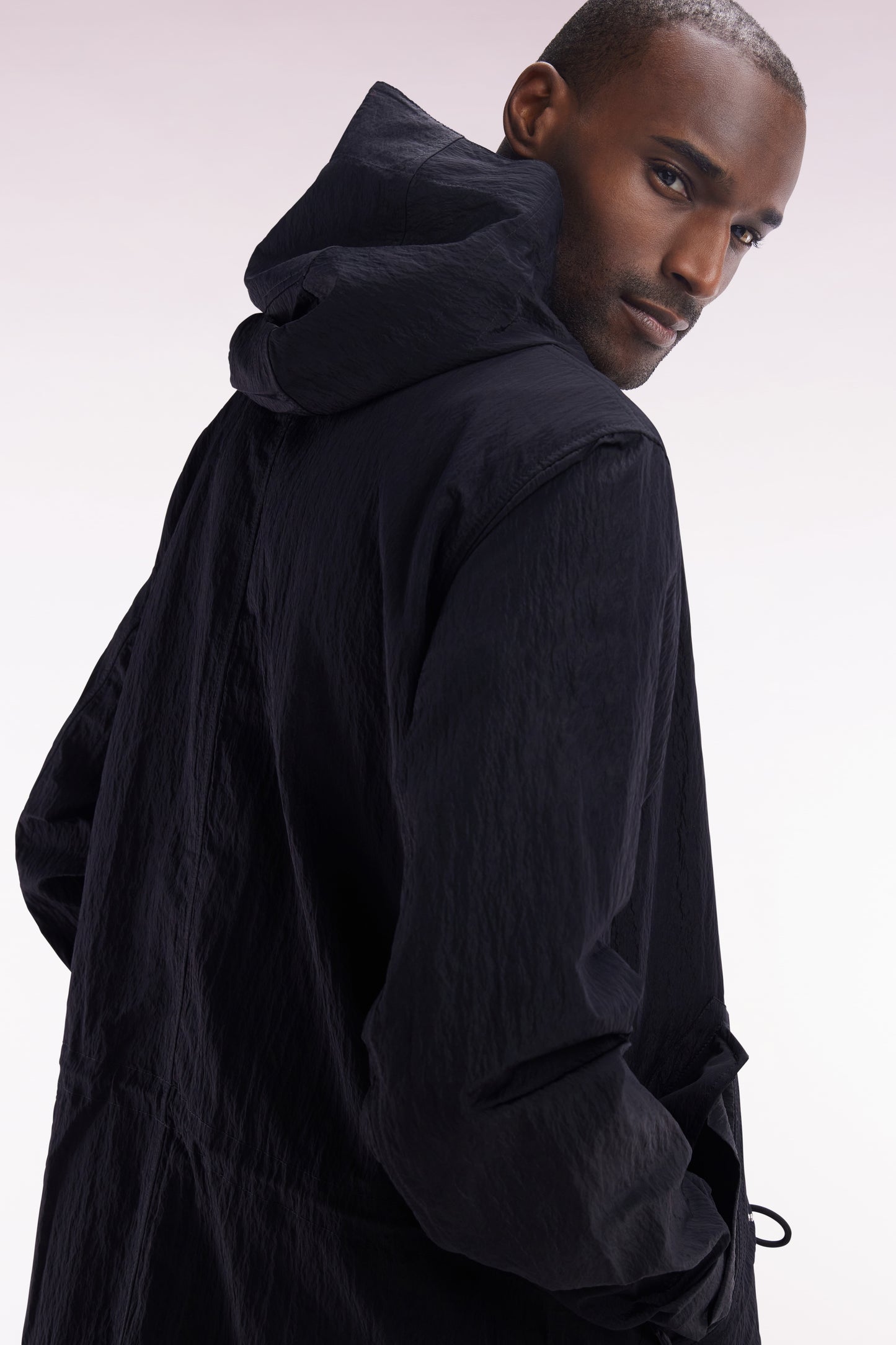 Lightweight black parka with integrated hood