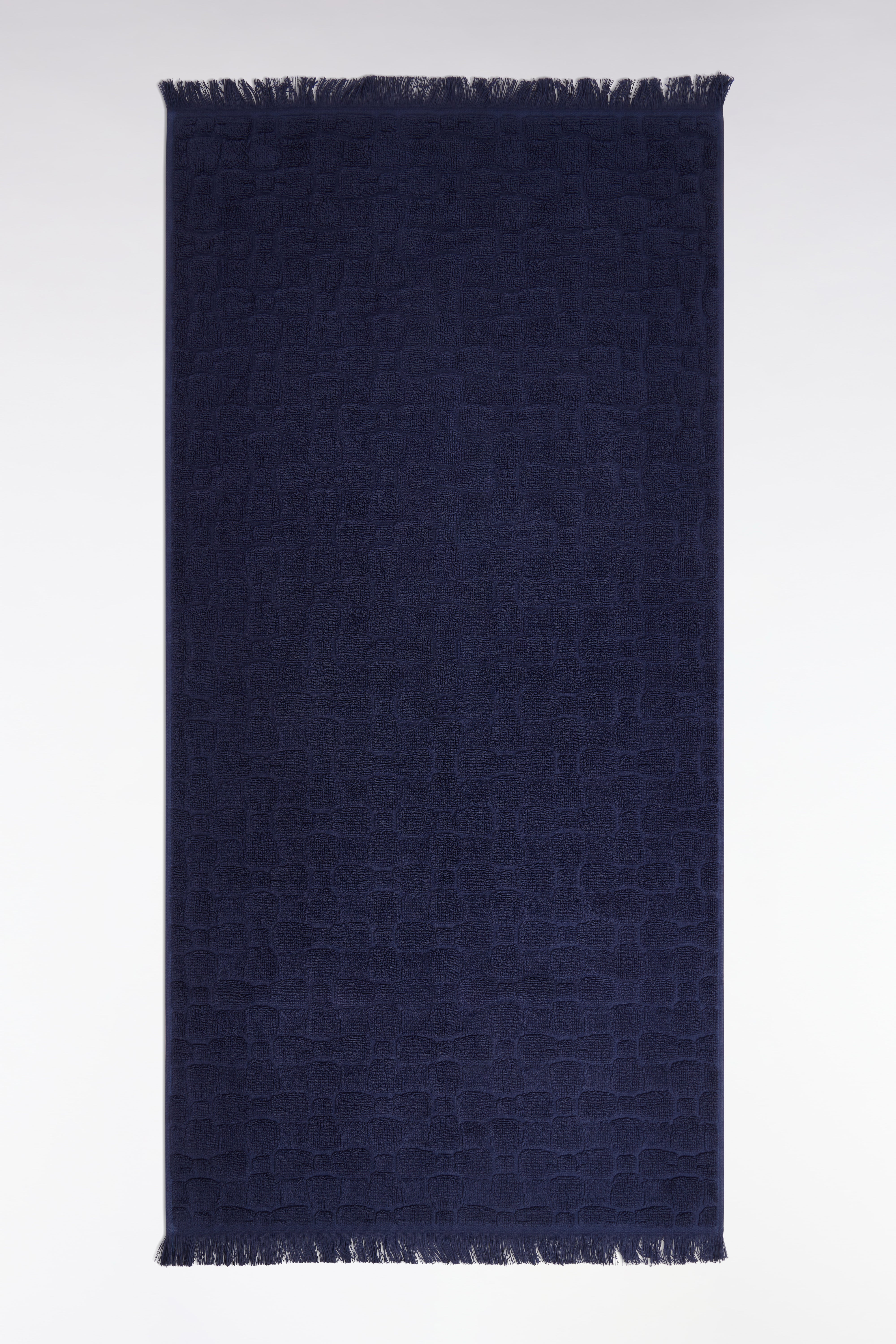 Serviette de toilette en coton marine à micromotifs nœuds papillon
