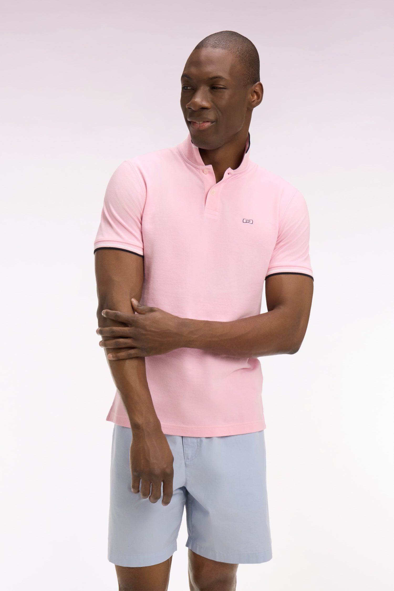Polo à manches courtes en coton rose détails rayés coupe regular