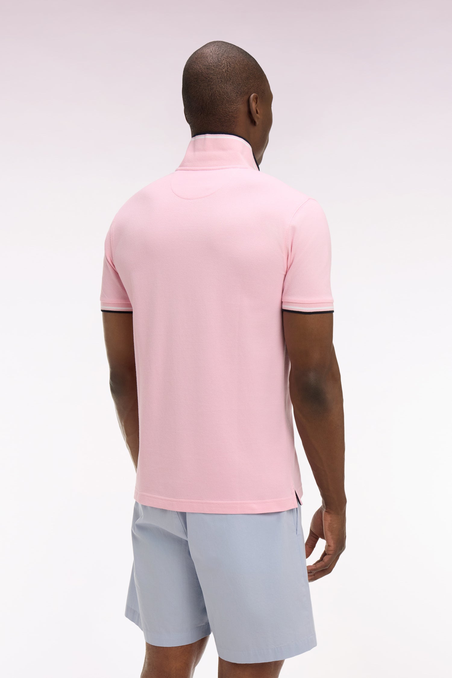 Polo à manches courtes en coton rose détails rayés coupe regular