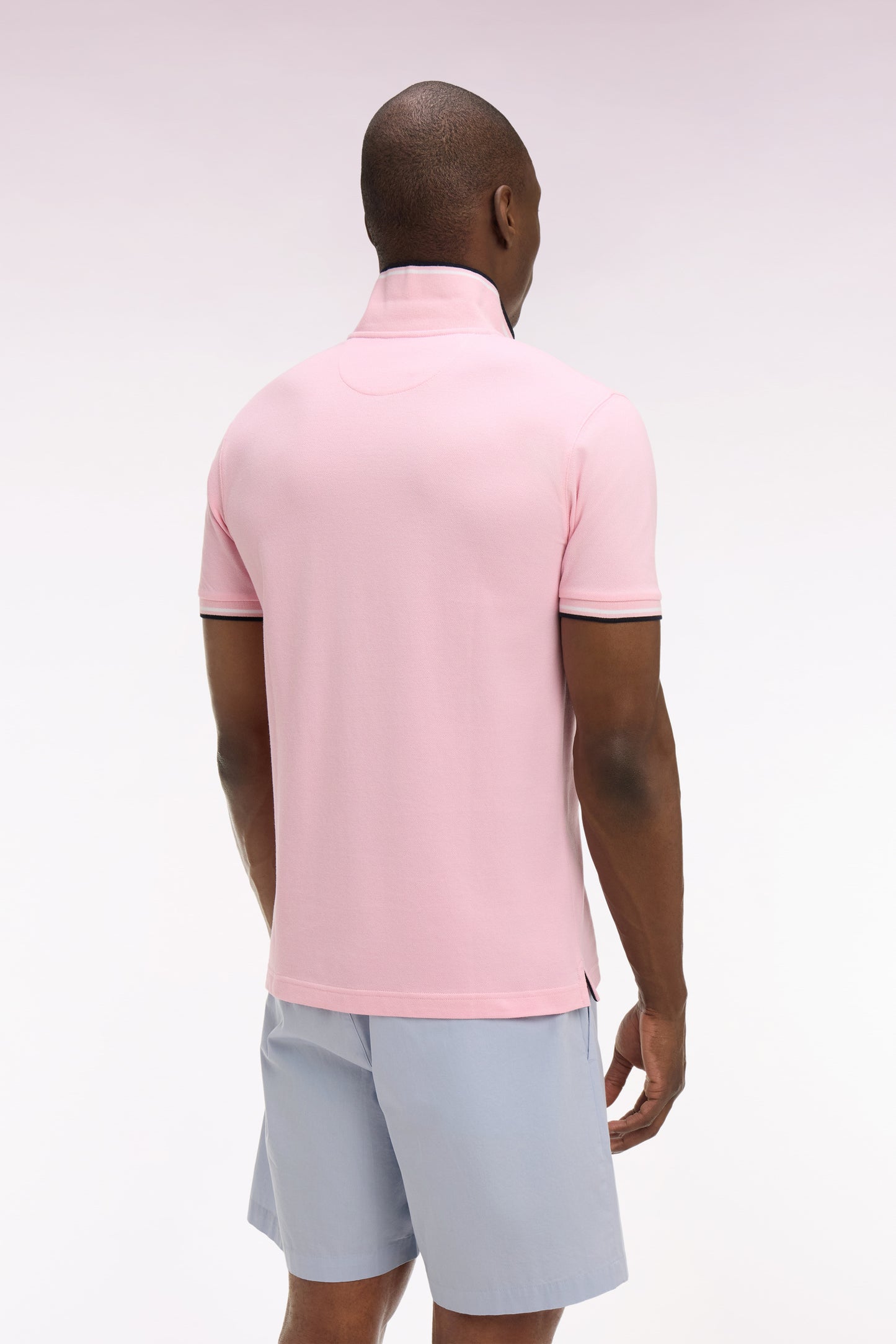 Polo à manches courtes en coton rose détails rayés coupe regular