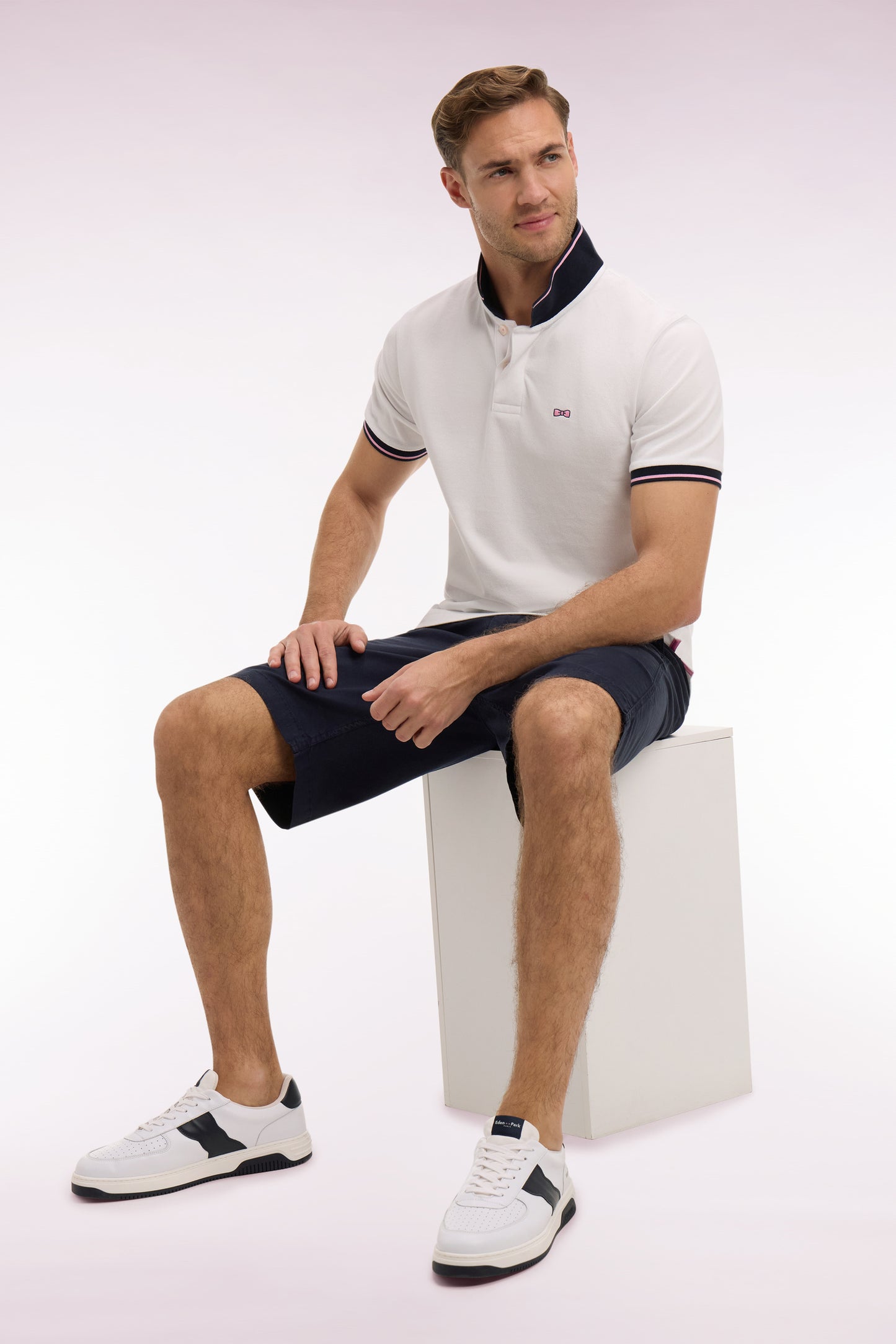 Short-sleeved polo shirt in white cotton pique with navy embroidery