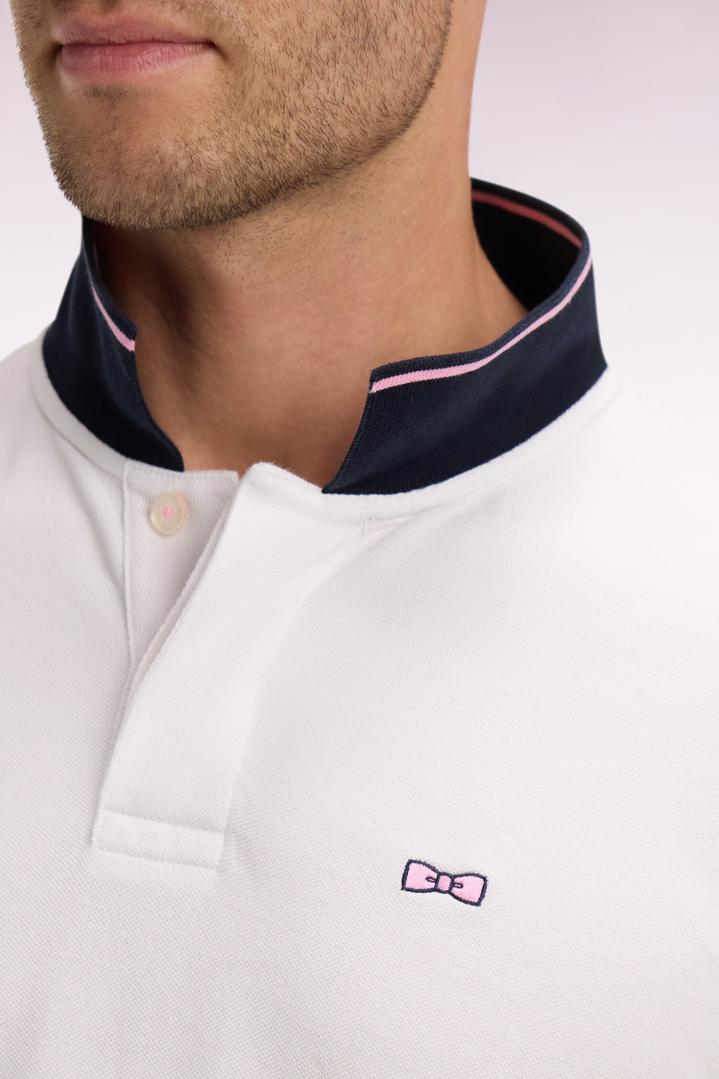 Short-sleeved polo shirt in white cotton pique with navy embroidery