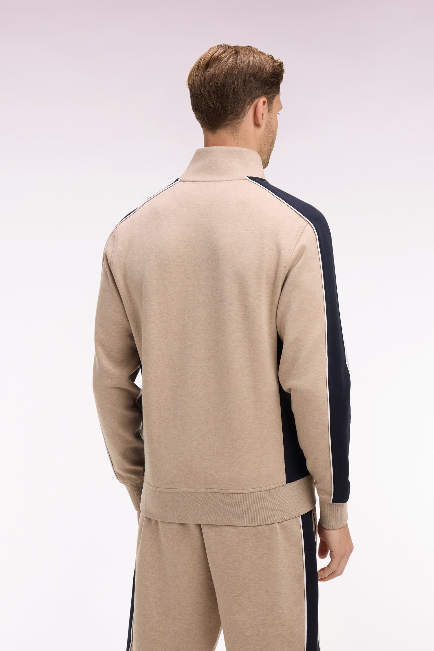 Sweatshirt zippé en interlock beige à découpes contrastées
