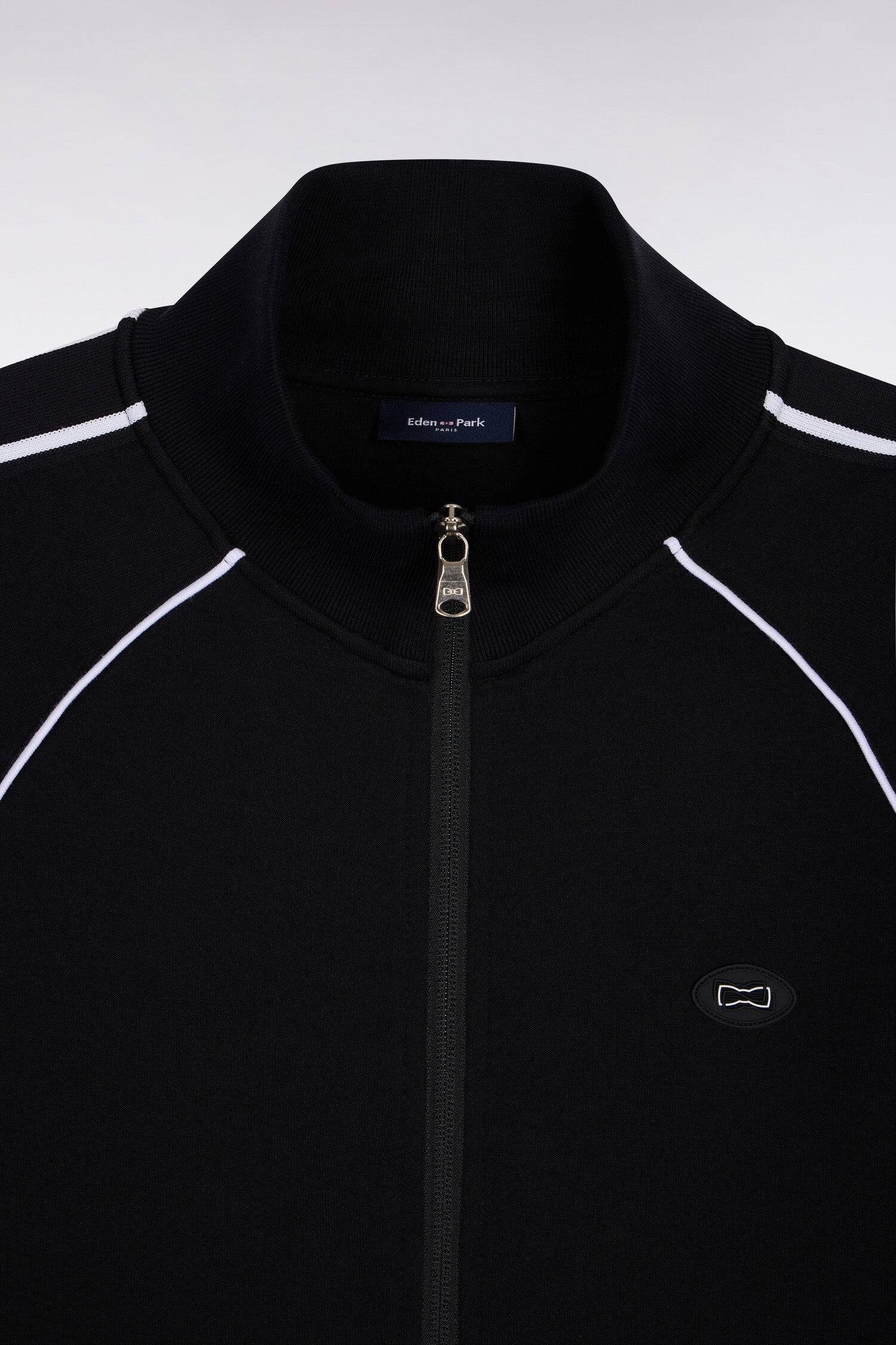 Sweatshirt zippé en interlock noir découpes ruban coupe regular