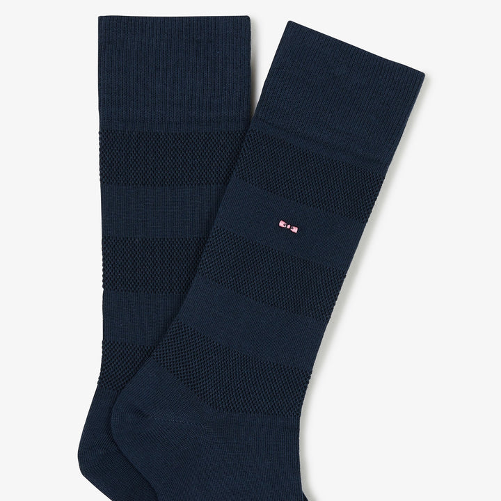 Paire de chaussettes bleues rayées unies