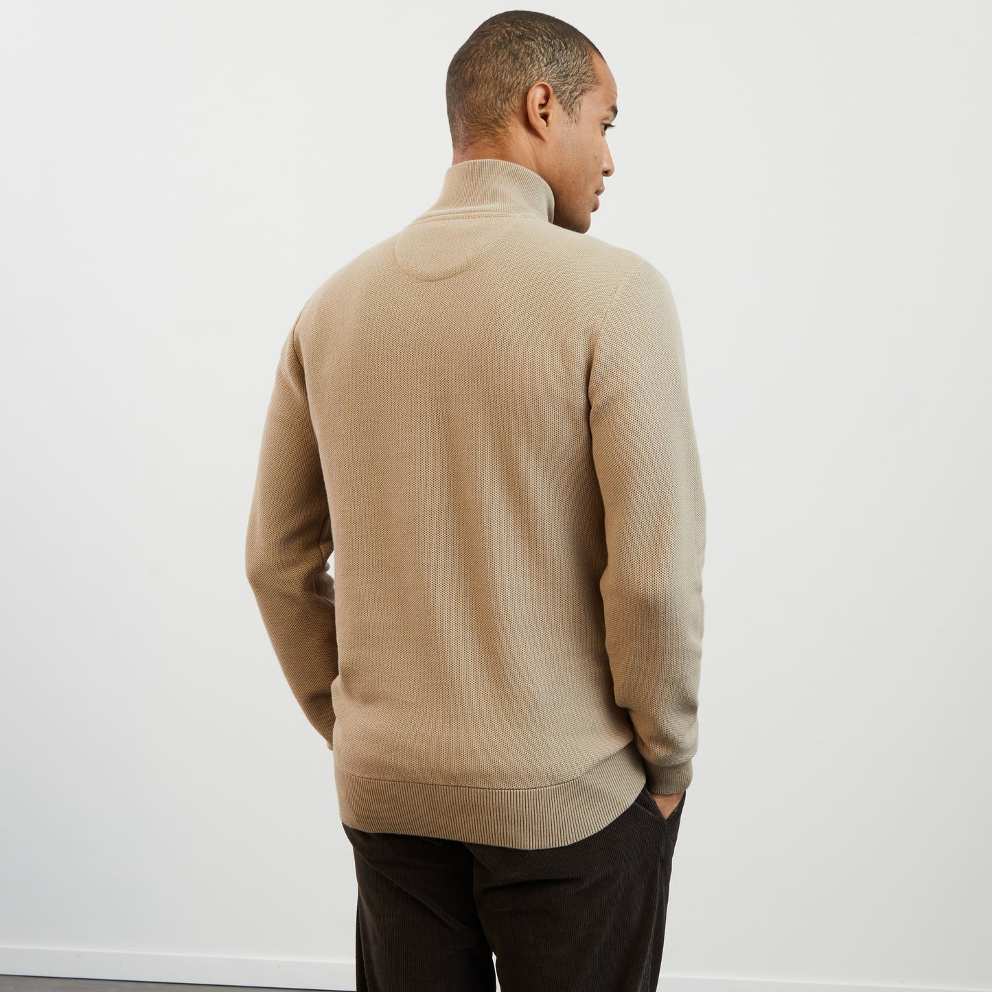 Beige zip-neck jumper in decorative cable knit