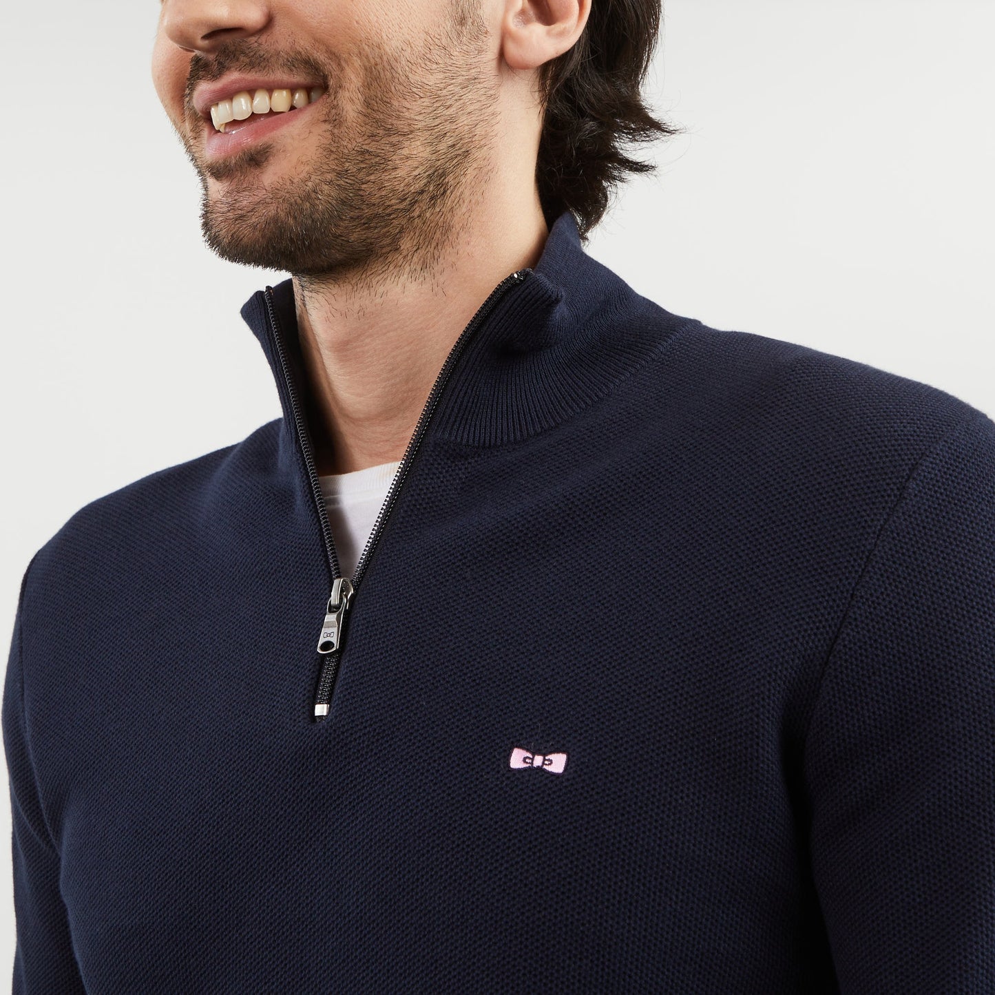 Dark blue zip-neck jumper in decorative cable knit