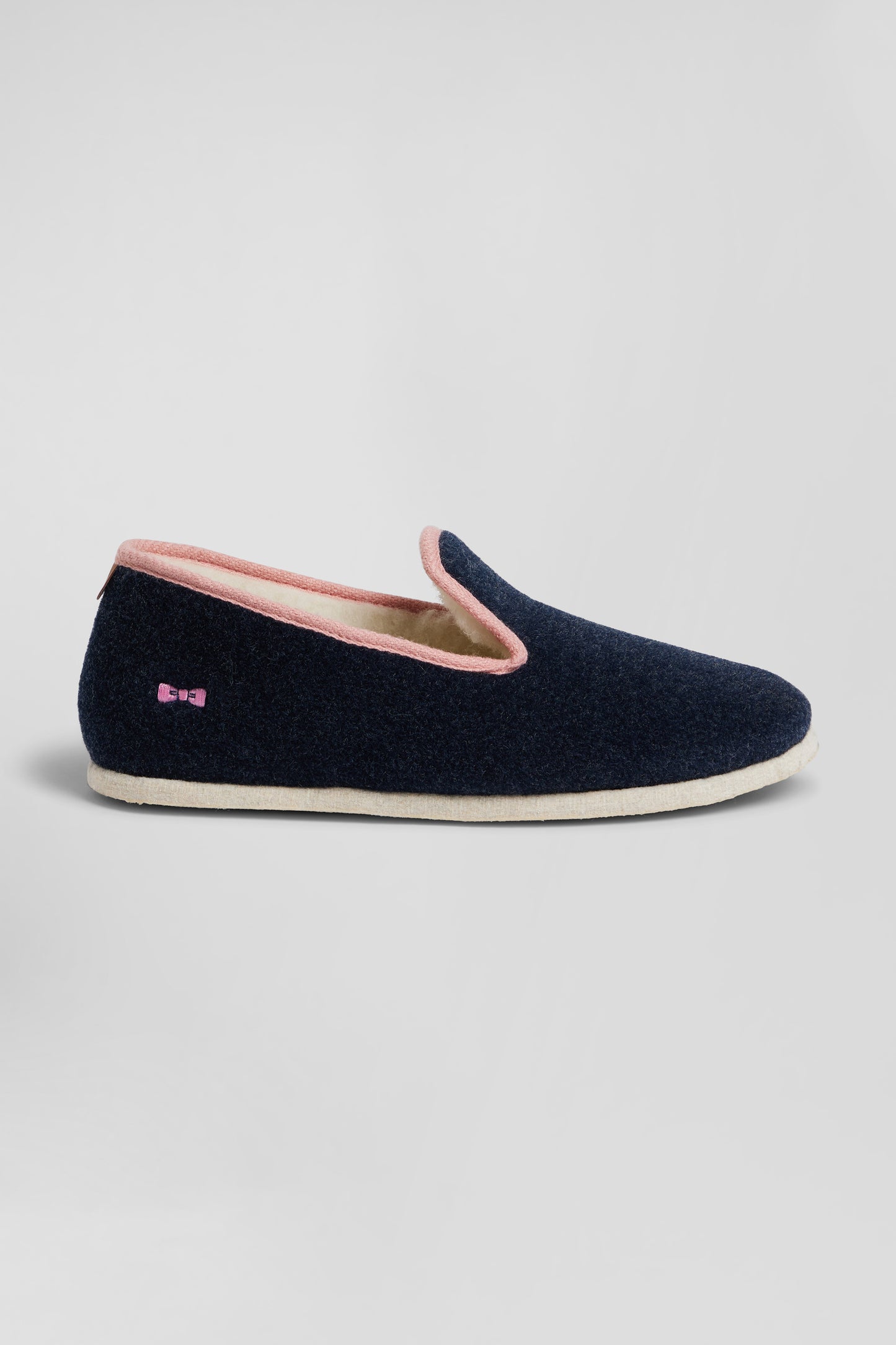 Navy blue shearling slippers with pink trim