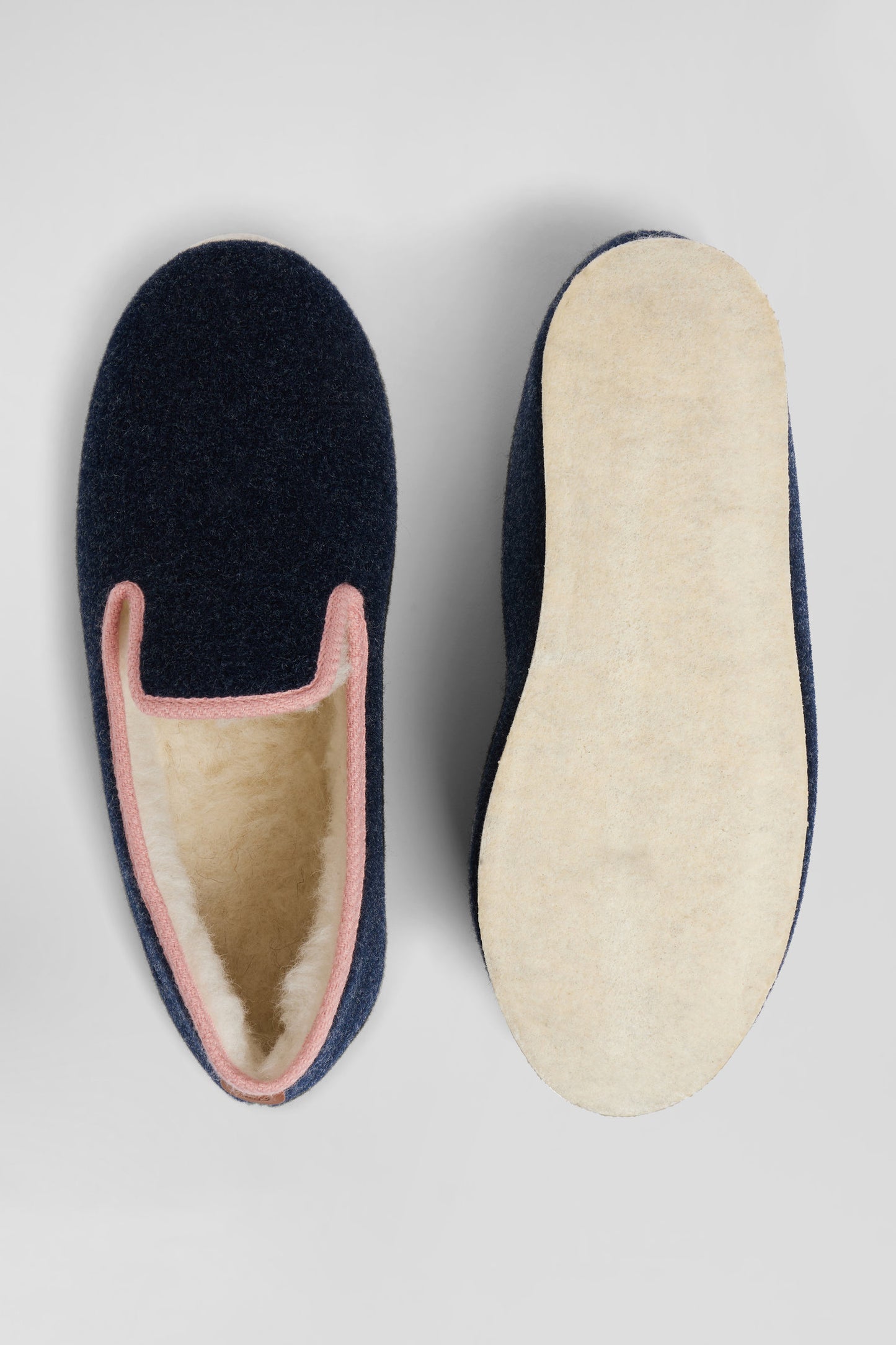 Navy blue shearling slippers with pink trim