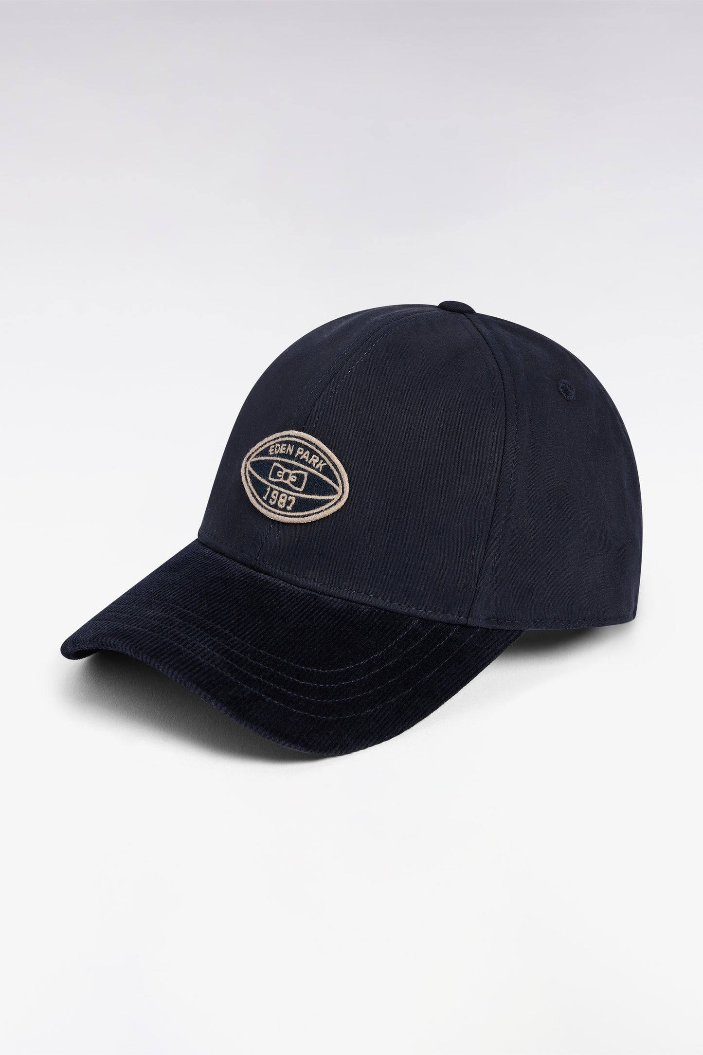 Casquette en coton bimatière marine visière en velours côtelé