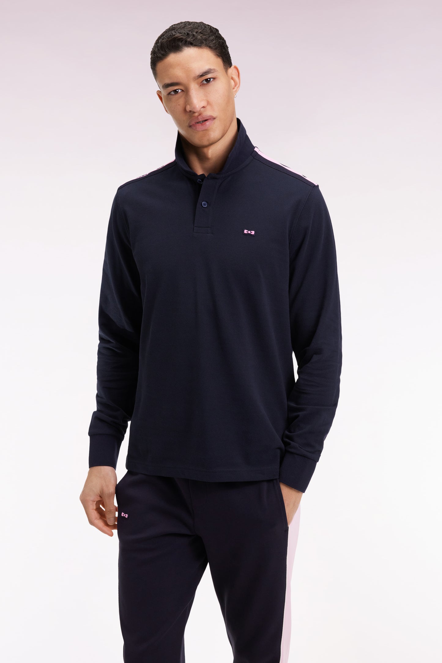 Long-sleeved polo shirt in navy cotton piqué with pink ribbon logo