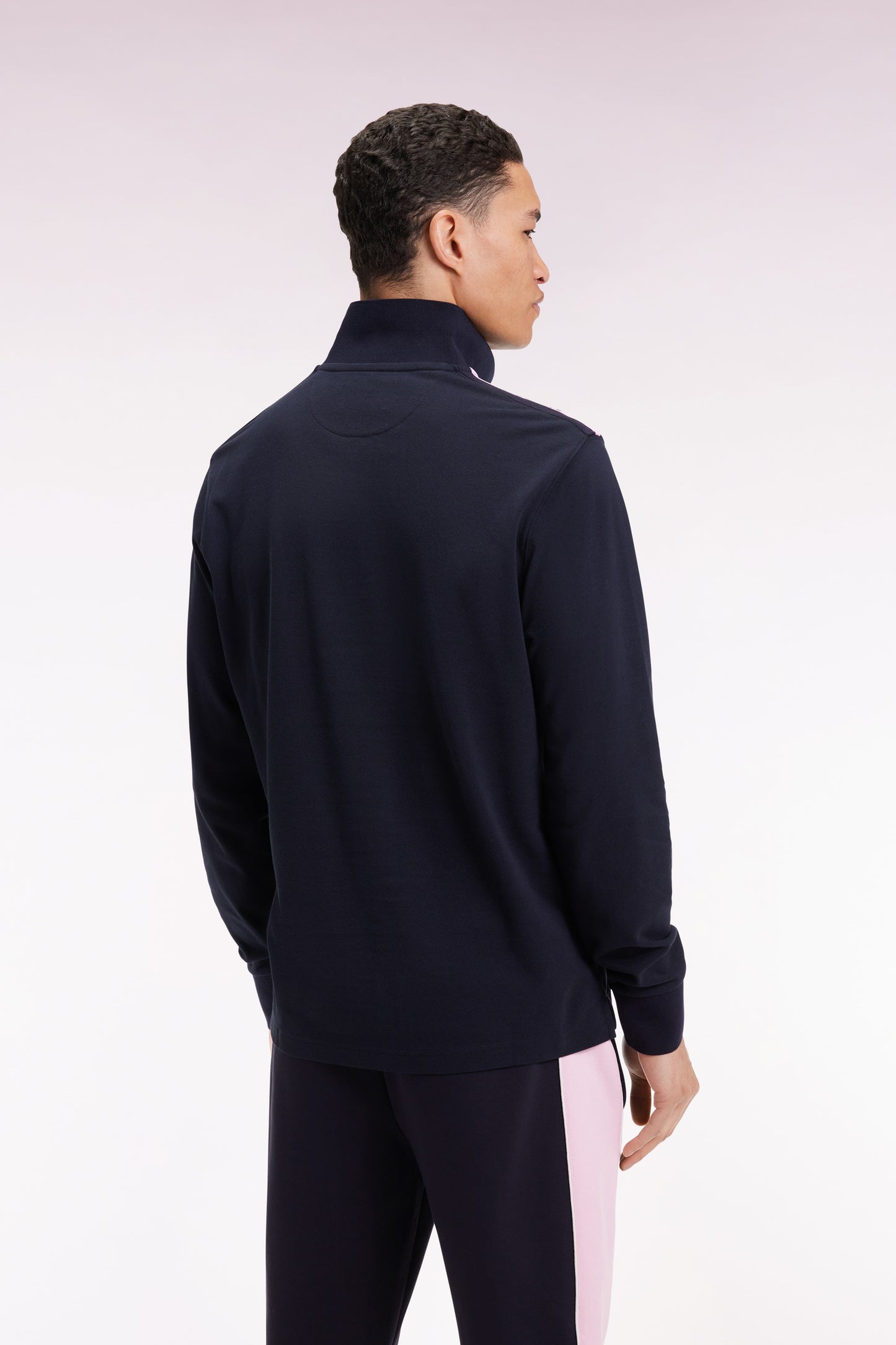 Long-sleeved polo shirt in navy cotton piqué with pink ribbon logo