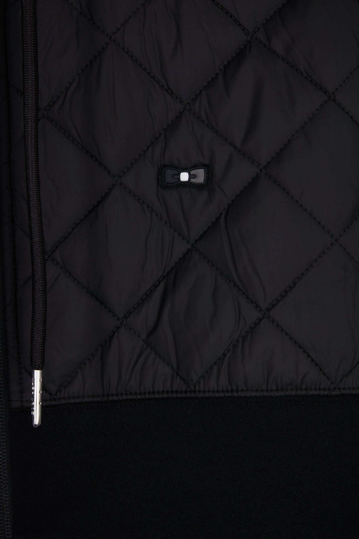 Sweatshirt zippé en interlock bimatière matelassé noir et gris