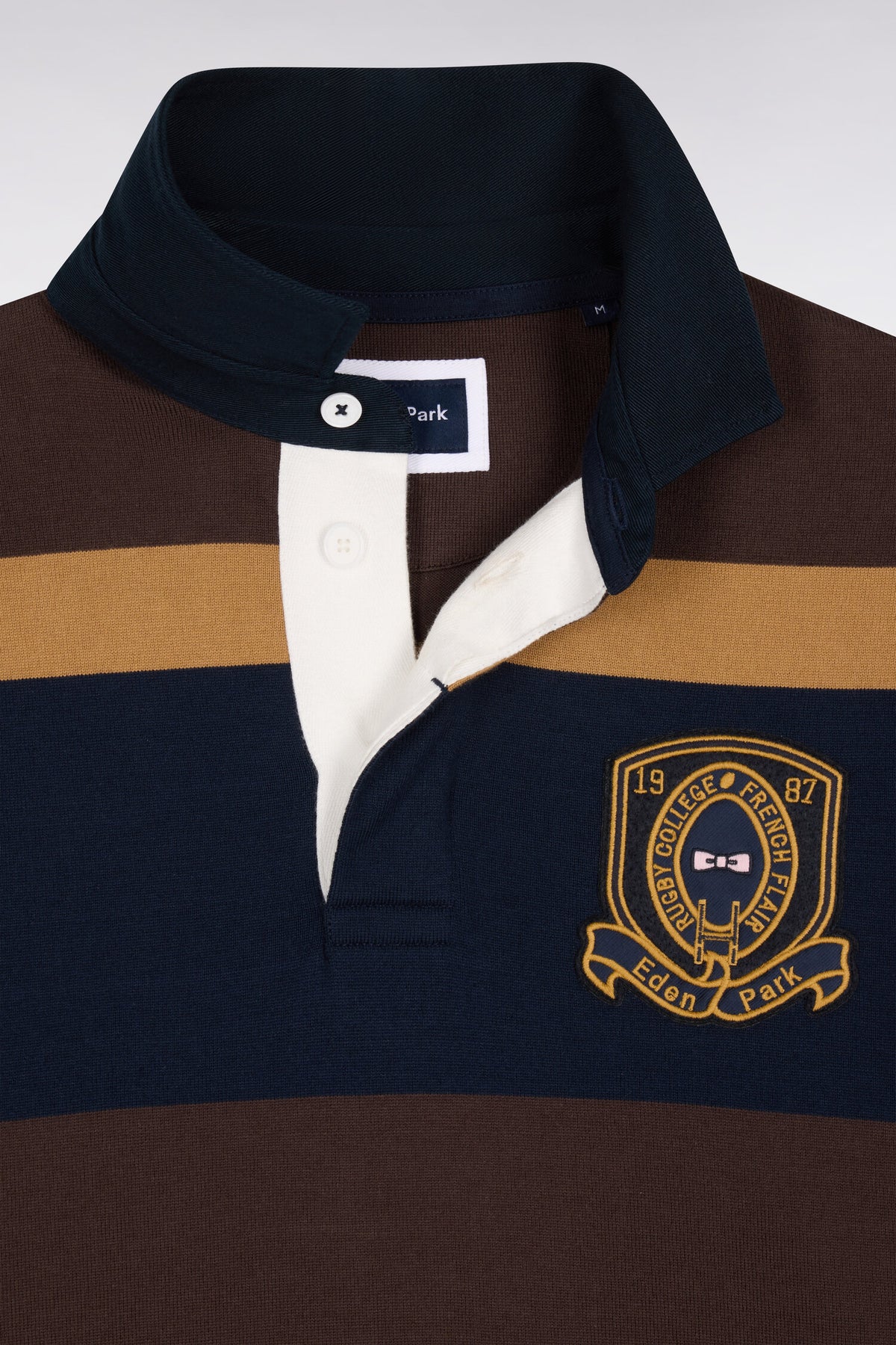 Maillot manches longues rayé marron avec broderie écusson