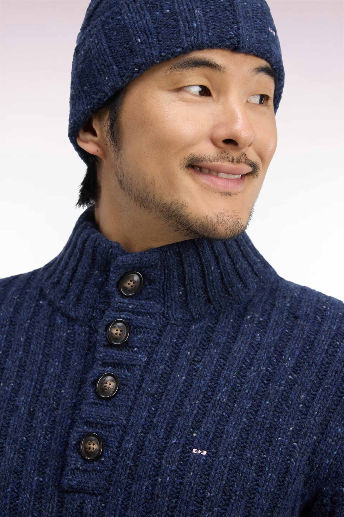 Buttoned high-neck sweater in heather blue ribbed chunky knit