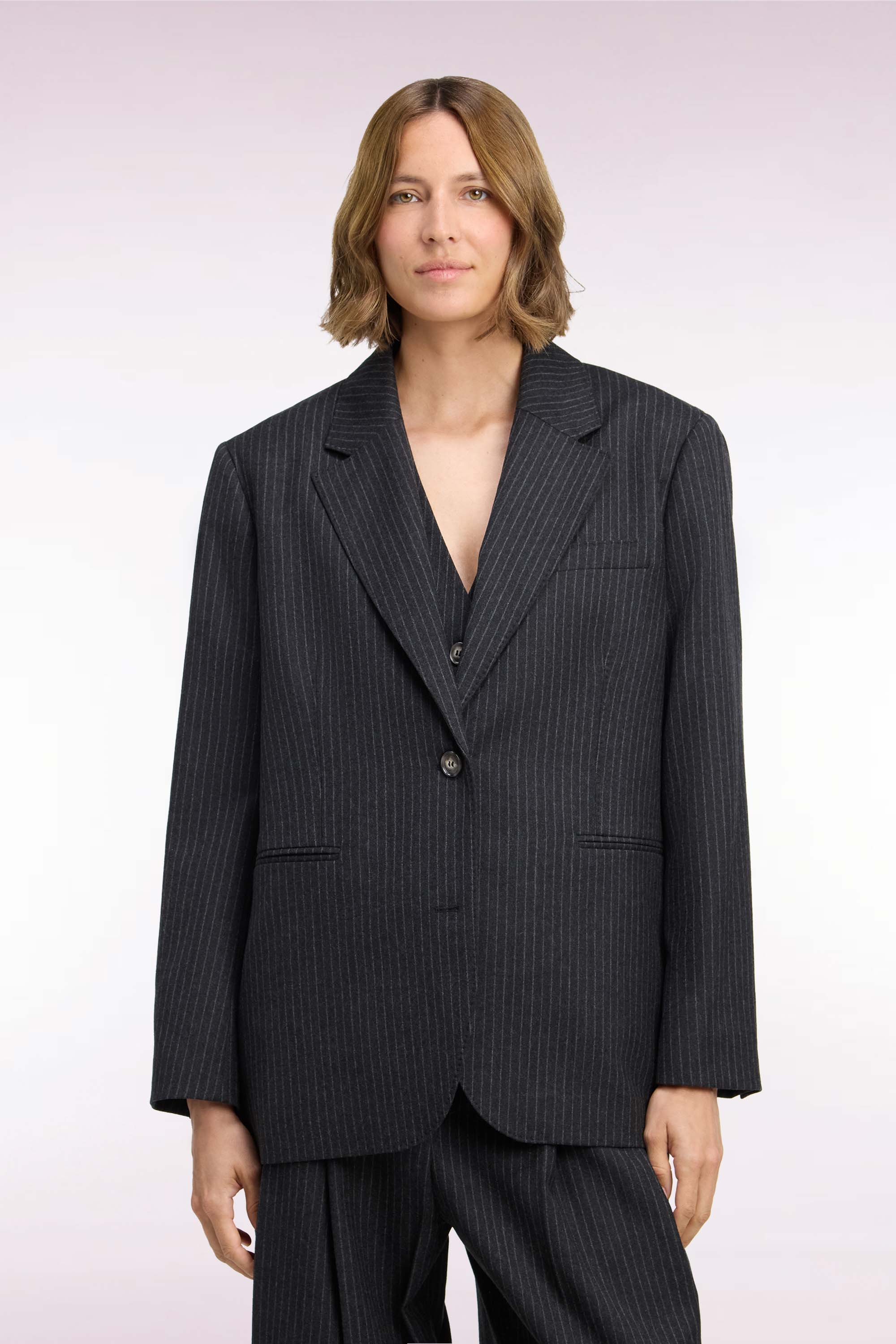 Veste blazer à manches rayées en laine stretch noir coupe oversized