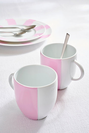 Set of two white Limoges porcelain mugs with pink enameled interior