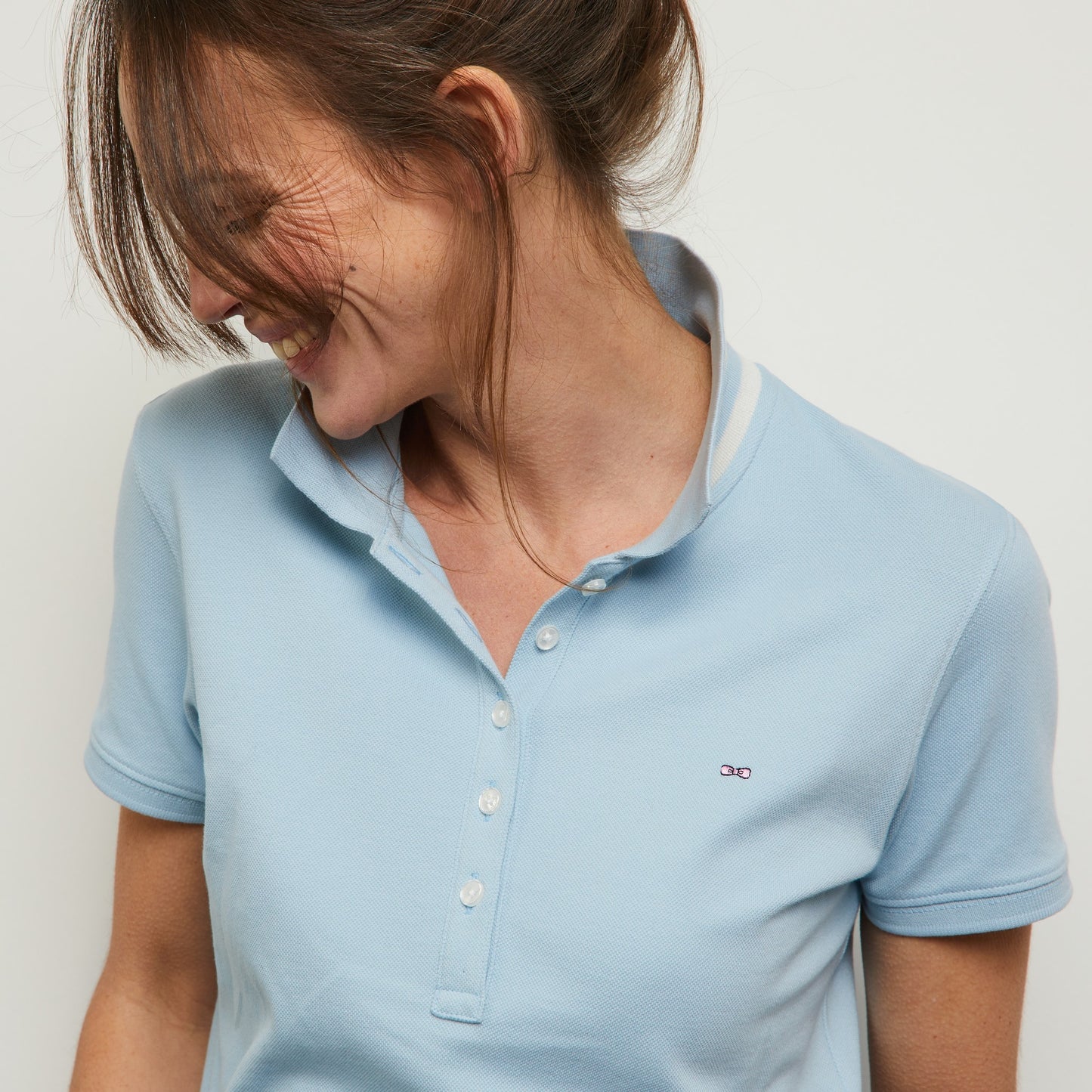 Light blue polo in Pima cotton pique, with striped collar
