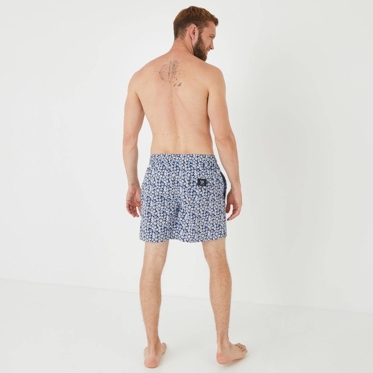 Blue swim shorts with floral pattern