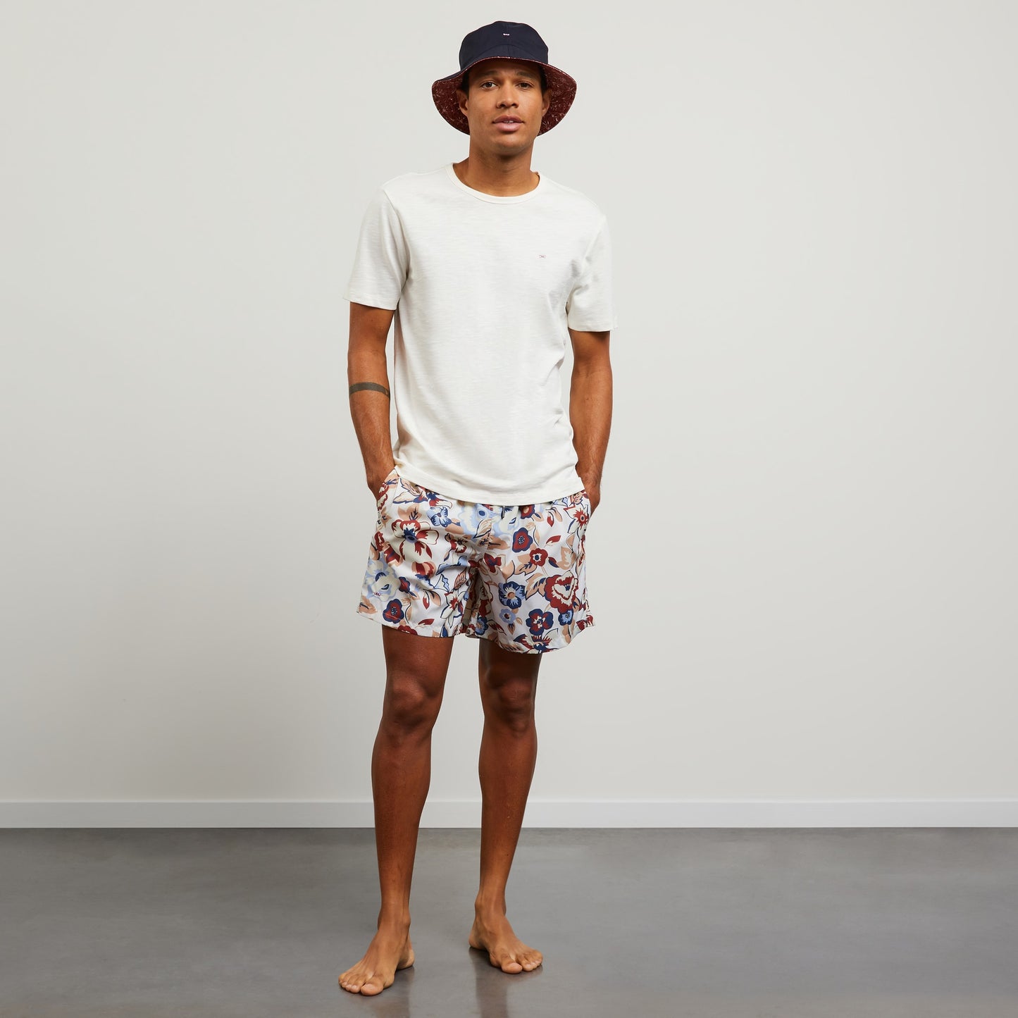 White swim shorts with exclusive floral print